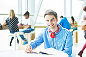 University student smiling in cafe
