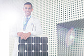 Portrait of scientist with solar panel