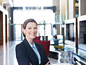 Businesswoman smiling in lobby