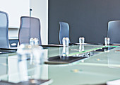 Glasses on empty conference room table