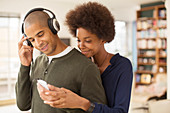 Couple using mp3 player together