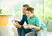 Father and son playing video games