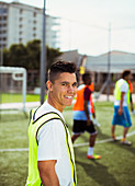 Soccer player smiling on field