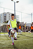 Soccer player training on field