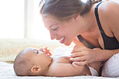 Mother playing with baby boy