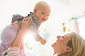 Mother playing with baby girl