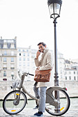 Businessman talking on phone in Paris