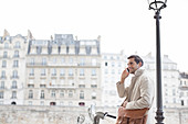 Businessman on bicycle in Paris
