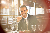 Businessman smiling at restaurant