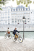 Men riding bicycles in Paris