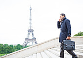 Businessmen on steps in Paris