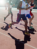 Runners racing on track