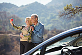 Senior couple taking self-portrait