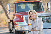 Woman talking near tow truck