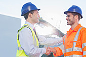 Businessman and worker handshaking