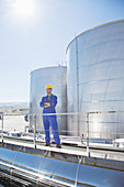 Worker with arms crossed on platform