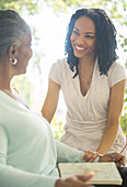 Happy mother and daughter talking