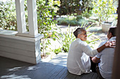 Senior couple hugging on porch