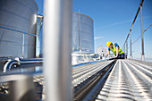 Worker looking down into milk tanker