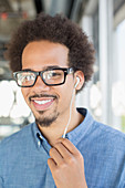 Portrait of man using hands-free device