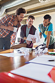 Creative businessmen reviewing paperwork