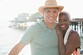 Portrait of happy senior couple on beach
