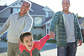 Multi-generation men laughing outdoors