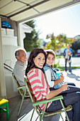 Smiling mother and daughter in garage