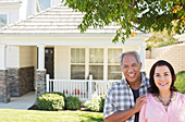 Portrait of smiling couple outside house