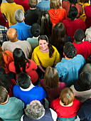 Smiling woman in crowd