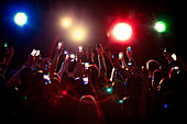 Audience using camera phones at concert