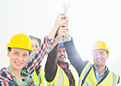 Construction workers joining hands