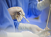 Mature surgeon using scalpel