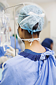 Rear view of female surgeon standing