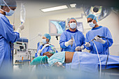 Team of surgeons operating on patient