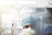 Surgeon wearing surgical cap and mask