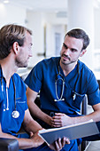Two male doctors with stethoscopes
