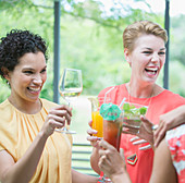 Women toasting each other at party