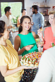 Woman serving friends at party