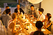 Friends eating together at dinner party