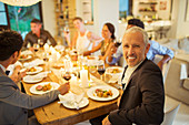 Man smiling at dinner party