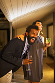 Couple laughing together at party