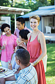 Woman smiling at party outdoors