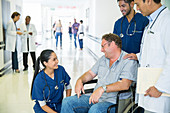 Doctor and nurses talking to patient