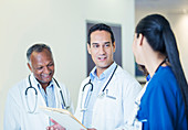 Doctors and nurse talking hallway