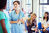 Nurse and patient talking in hospital