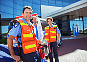 Paramedics smiling outside hospital