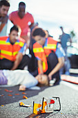 Paramedics examining injured girl