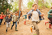 Children running in forest