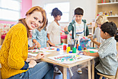 Teacher and students painting